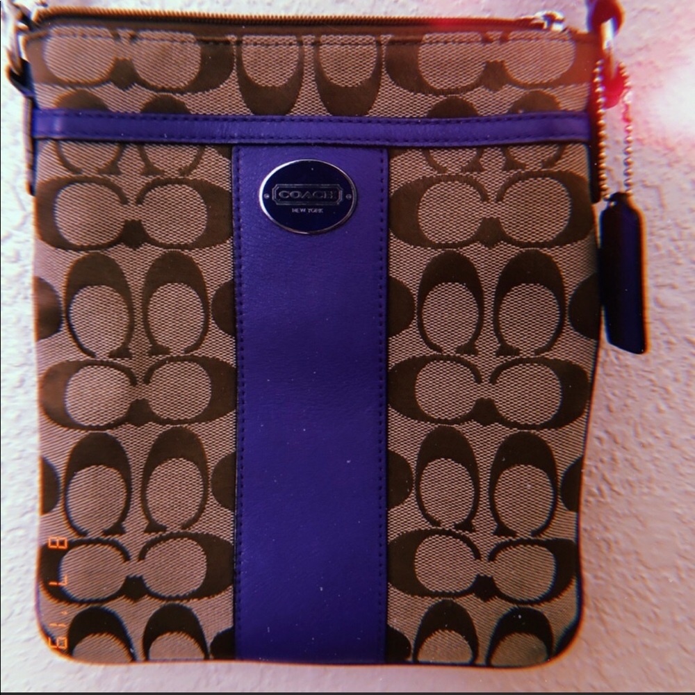 crossbody Coach brown bag w/ purple lining